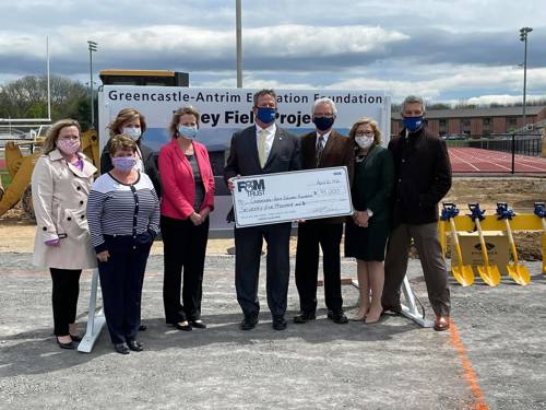 representatives from F&M Trust and GAEF pose for a photo